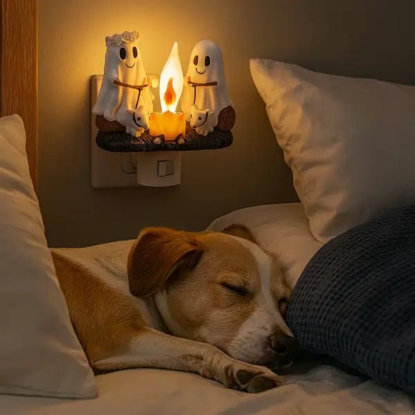 Ghost campfire night light glowing softly on a bedroom wall above a sleeping dog