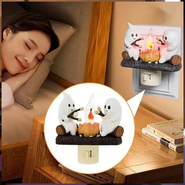 Ghost campfire night light on a bedside wall socket, shown beside a person sleeping in the room