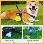 Corgi on grass with yellow dog poop scooper attached to harness, demo of poop pick-up tool.