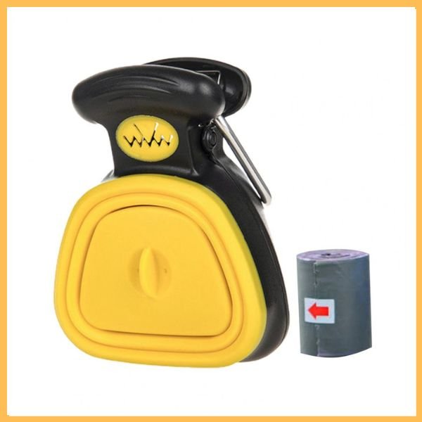 Yellow and black dog poop scooper with waste bag roll on white background