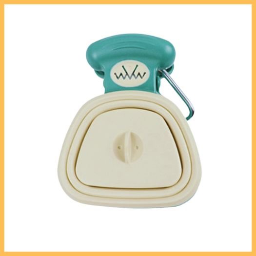 green and beige pet waste scooper with handle clip on white background