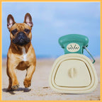French bulldog on beach with portable dog poop scooper