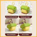 Green and yellow cleaning roller tool removing paper scraps, hair, and residues from surfaces