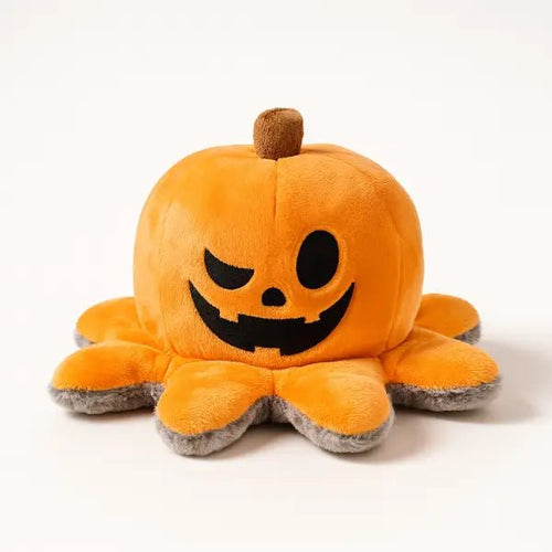 Halloween dog toy shown with its orange jack-o-lantern pumpkin face on a plain background