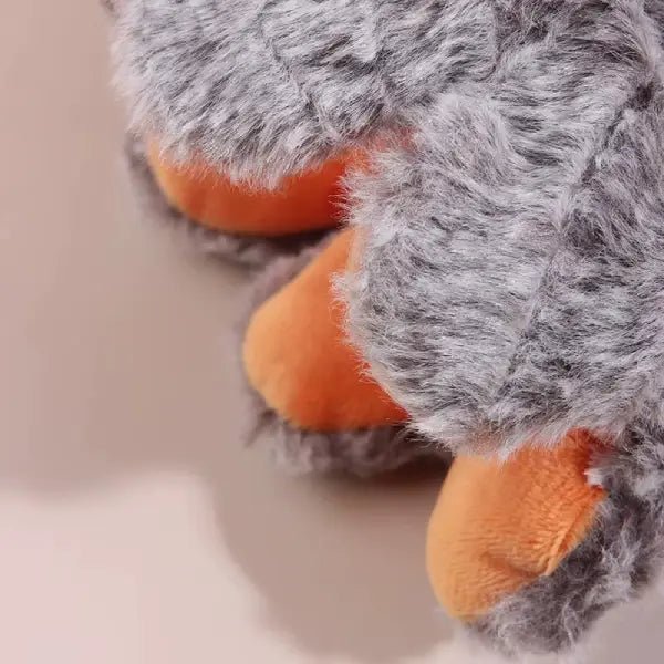 Close-up of the halloween dog toy's tentacle feet, grey fur on top with orange underneath