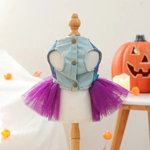 Back view of the halloween dress for dogs showing the denim bodice with metal button closures and purple tulle skirt