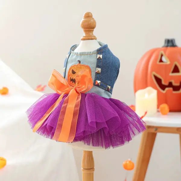 Halloween dress for dogs on a mannequin, showing metal stud details on the denim bodice and pumpkin patch