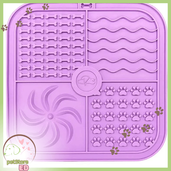 Purple silicone dog lick mat with bone, paw, swirl, and wave patterns, pet feeding accessory