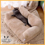Gray cat lounging on a beige plush pet bed sofa, cozy indoor setting, 65 cm size.