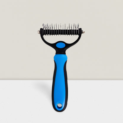 Best tool for coat care – undercoat rake for dogs in blue.