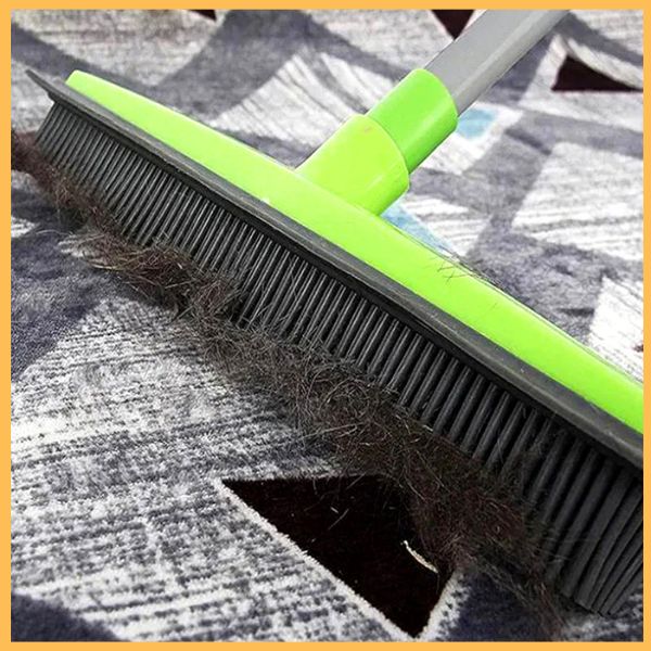 Silicone broom cleaning pet hair from carpet