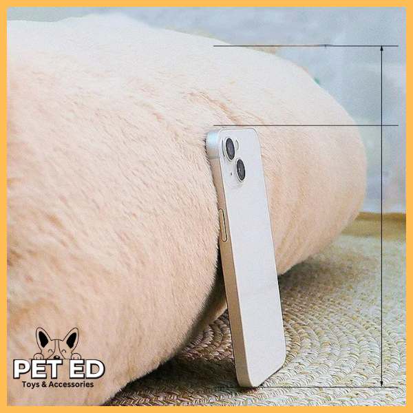 Size comparison of plush pet bed with smartphone on woven mat, Pet Ed branding visible.