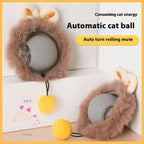 Grey interactive automatic cat ball with fur, bunny ears, and yellow pompom toy