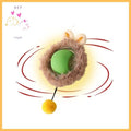Green interactive cat toy ball with plush ring, bunny ears, and yellow pompom
