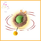 Green interactive cat toy ball with plush ring, bunny ears, and yellow pompom