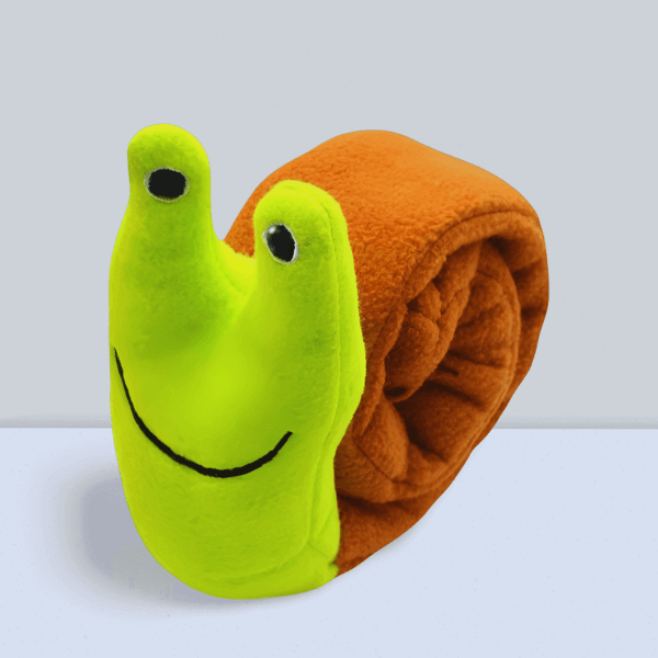 SnugBug Snail Green plush dog treat toy rolled into its compact snail shape