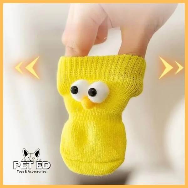 Hand holding a flexible yellow pet sock with cute eyes, PET ED Toys & Accessories logo visible.