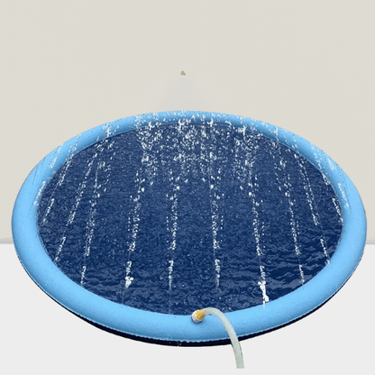 View of a filled sprinkler splash pad with hose attached.