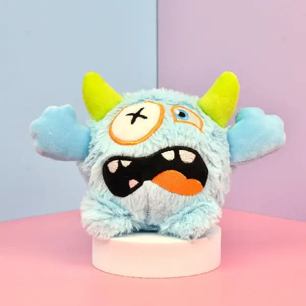 Light blue squeaky dog toy plush with monster face design