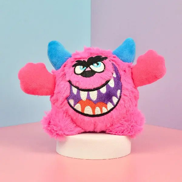 Pink squeaky dog toy plush with monster face design