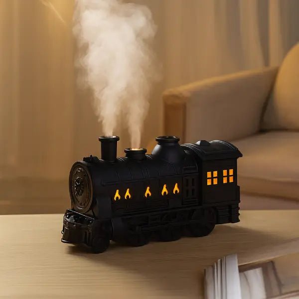 Close-up of the train diffuser releasing mist on a table in front of a sofa
