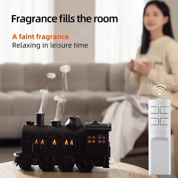 Train diffuser with its included remote control shown in a living room setting