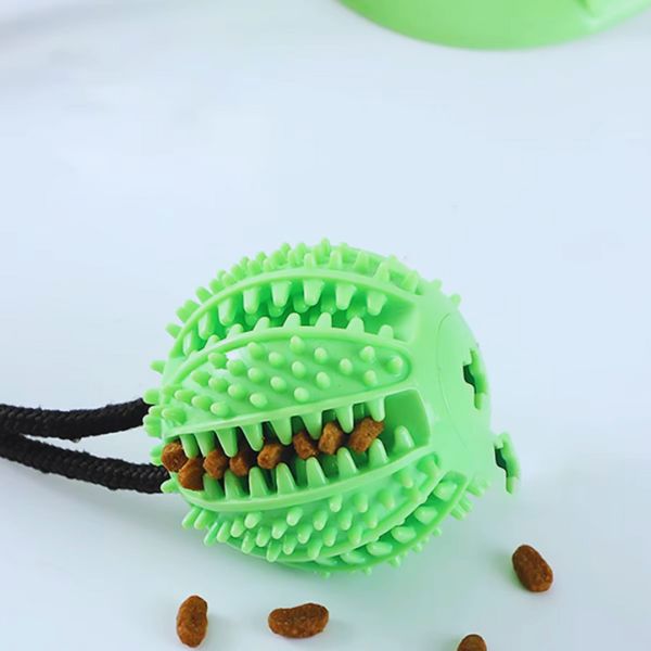 Green textured ball of TugBite, the perfect dog toy to relieve boredom.