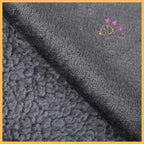 Close-up of grey waterproof fabric and sherpa dog blanket texture