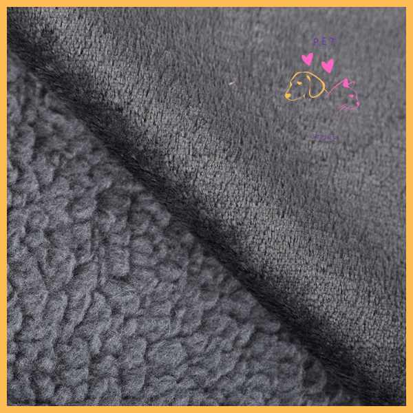 Close-up of grey waterproof fabric and sherpa dog blanket texture