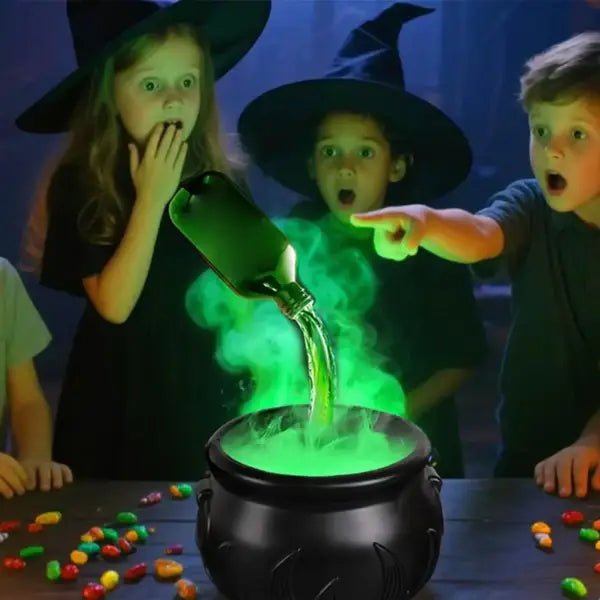 Children in witch hats reacting to green mist rising from a witches cauldron at a Halloween party