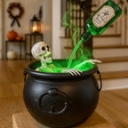 Witches cauldron with skeleton and green mist displayed on a table in a Halloween-decorated entryway