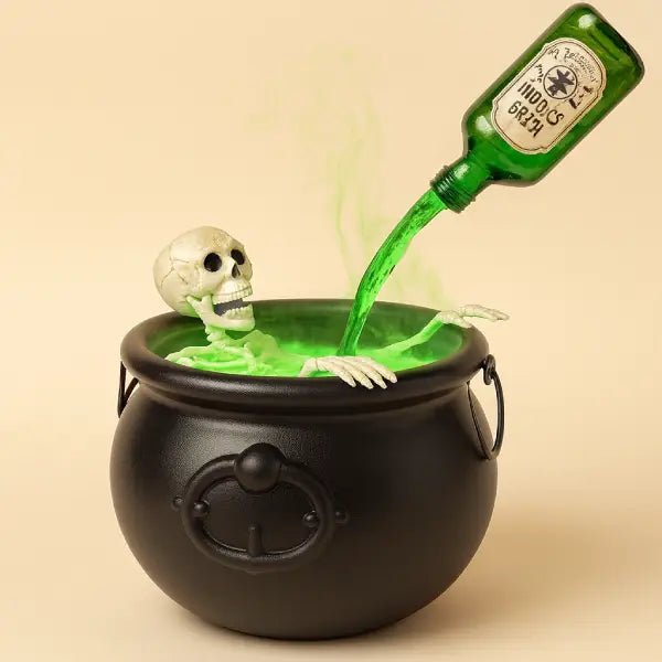 Witches cauldron with a skeleton and glowing green mist pouring from a potion bottle on a plain background